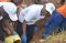 The EASF Director (center) during the community work session of the EASF Open Day in Rwanda 