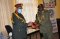  The outgoing Force Commander Maj. Gen. Aladdin Osman Mirghani receives a gift from the Chief of Staff, EASF Logistics Base Brigadier Godwin Karugaba on 23rd July 2020.   