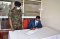 EASF Director Brig Gen Getachew Shiferaw Fayisa signs the Visitors' Book at the Humanitarian Peace Support School (HPSS) in Embakasi, Nairobi on 10th September 2021. On the left is the Commandant of the HPSS, Col Philis Adukan Nadio. 