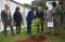 Colonel Rasmussen takes part in the traditional tree-planting exercise accompanied by the Director and some senior members of staff. 